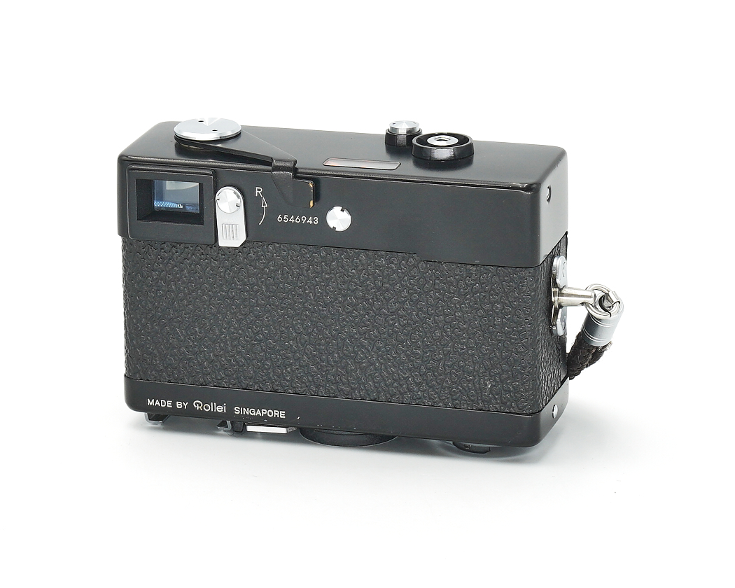 Filmkamera, schwarz, Spiegelreflex? (rangefinder), integrierter Sucher, hergestellt in Singapore